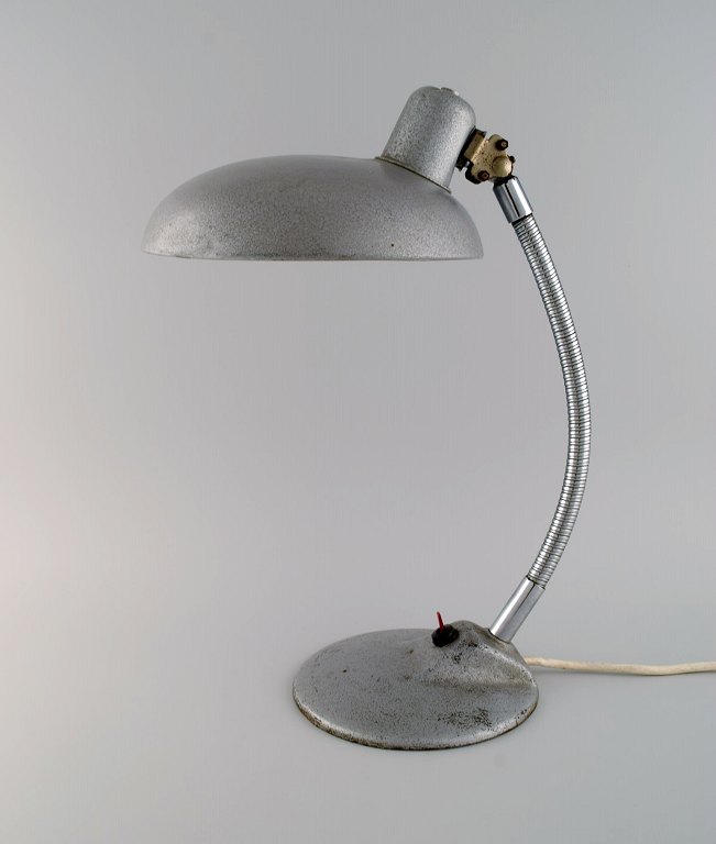 Adjustable desk lamp in original metallic lacquer. Industrial design, mid 20th century.