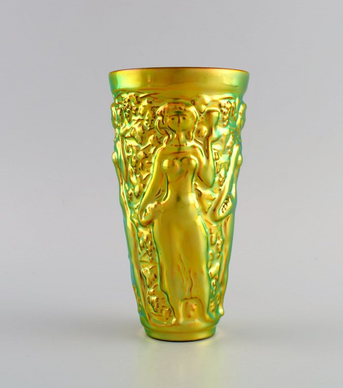 Zsolnay vase in glazed ceramics modeled with women picking grapes. Beautiful luster glasses. Late 20th century.