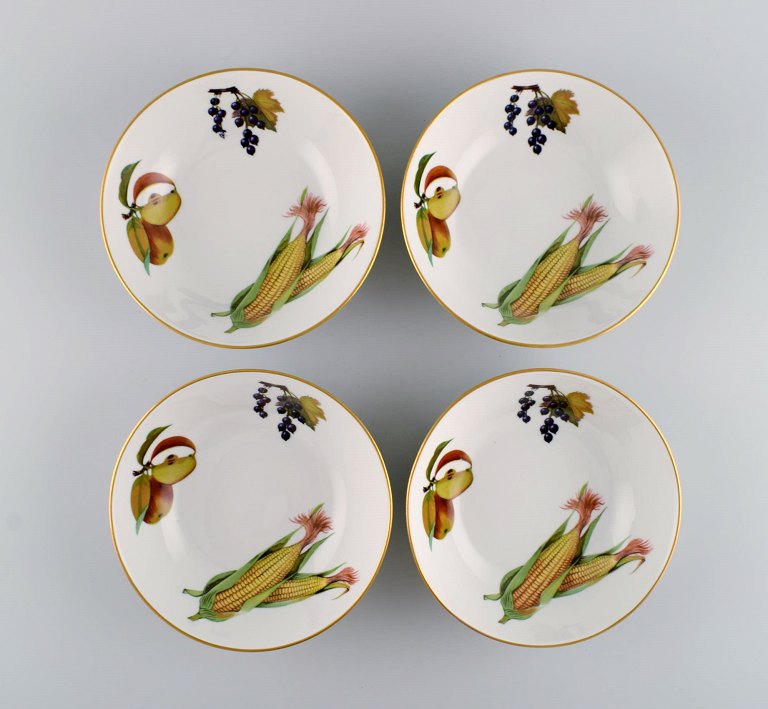 Royal Worcester, England. Four Evesham porcelain bowls decorated with fruits and gold rim. 1980s.