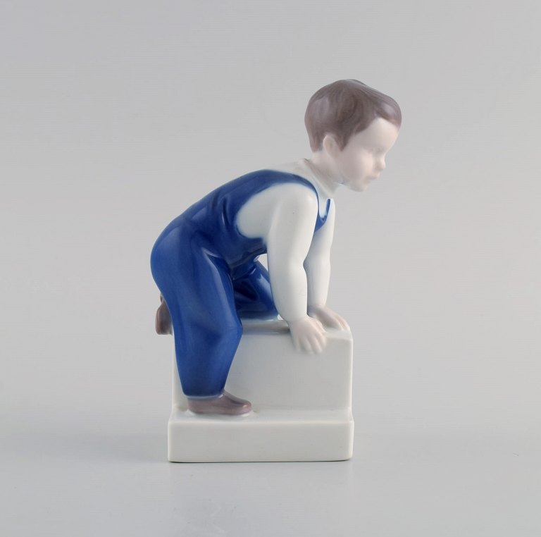 Claire Weiss for Bing & Grøndahl. Porcelain figure. Boy. 1970s. Model number 2399.