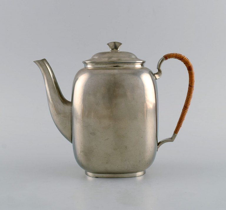Just Andersen (1884-1943), Denmark. Art deco tin coffee pot with wicker handle. 1940s. Model number 2421.