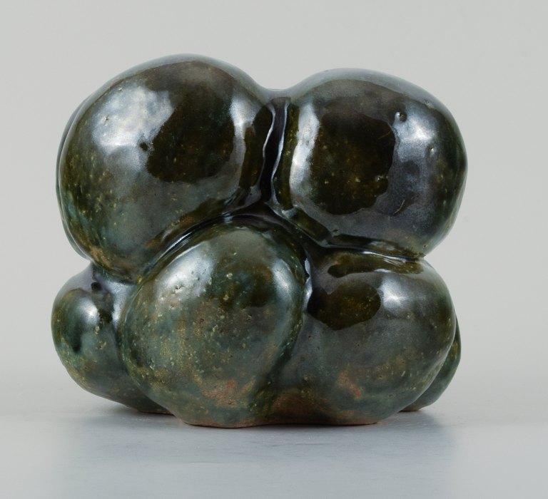 Christina Muff, Danish contemporary ceramicist (b. 1971). Organic shaped vessel glazed with shiny green glaze. Made from coarse, repurposed stoneware clay.