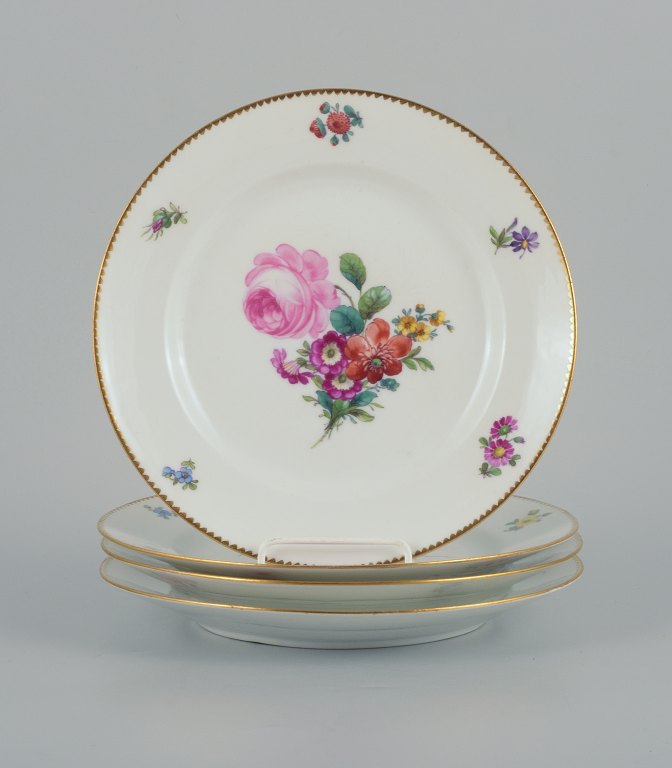 B&G, Bing & Grondahl Saxon flower.Four dinner plates decorated with flowers and gold rim.