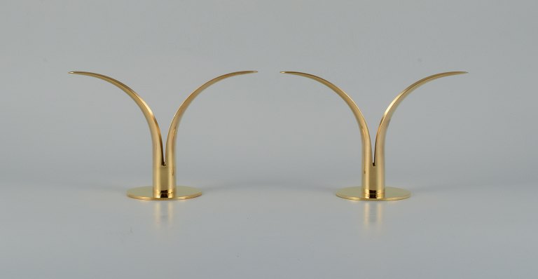 "Liljan", Ivar Ålenius Björk for Skultuna, a pair of candlesticks in patinated brass.