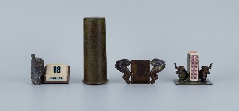 Danish design. Four bronzes consisting of a piggy bank, calendar, matchbox holder and a place card holder.