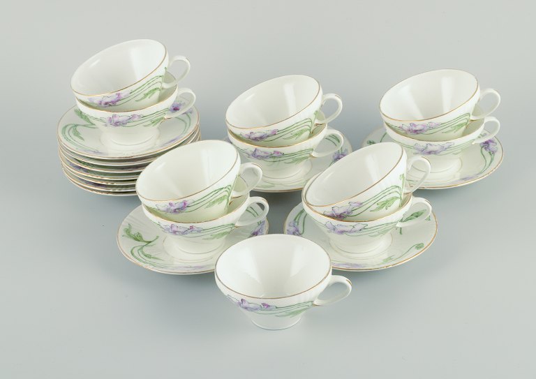 Rörstrand, Sweden.A set of eleven Art Nouveau porcelain teacups with saucers.