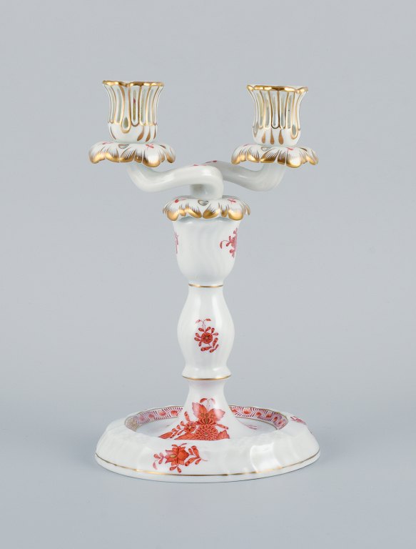 Herend, Hungary, two-armed porcelain footed candlestick, hand-painted with orange flowers.