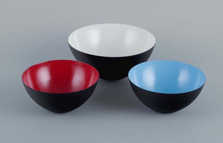 Three bowls in metal.Blue, red and white.