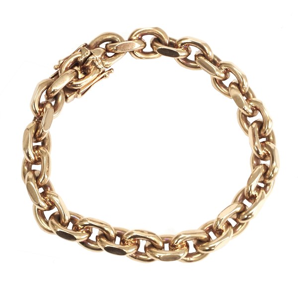 Kraftig anker armlænke med facetterede led i 14 kt guld stemplet Bræmer med kasselås og to sikkerhedslåse. L: 19,5cm. V: 66gr. Ledstr: 11x9mm