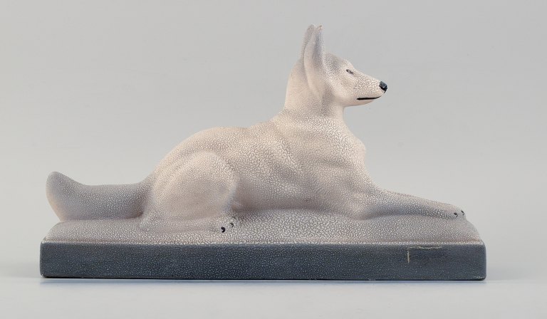 Francois Levallois (1882-1965).Reclining dog in ceramics, art deco.
