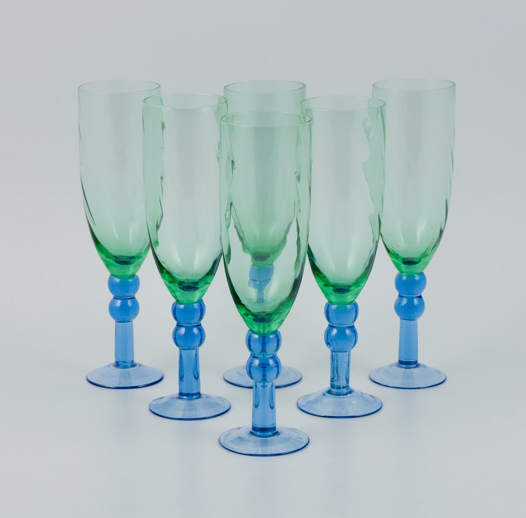 Scandinavian glass artist, a set of six hand-blown champagne glasses in green and blue glass.