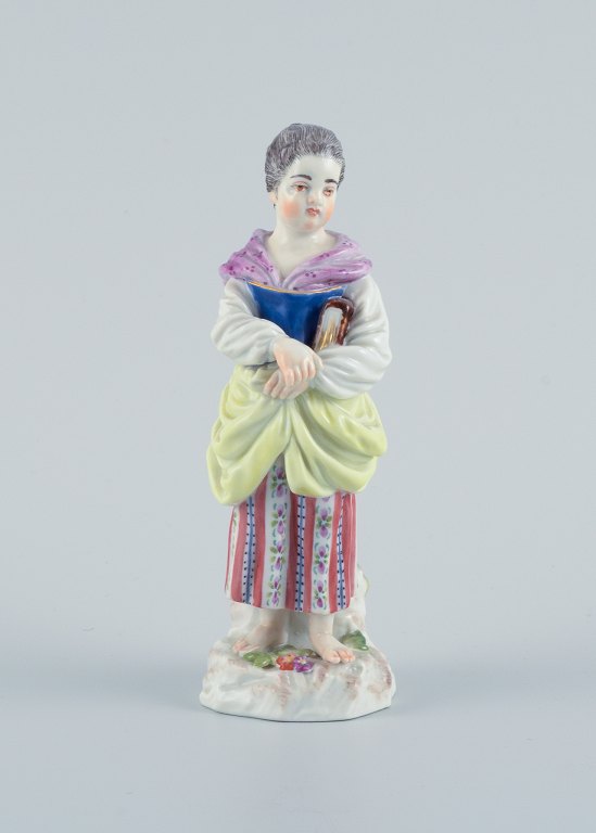 Meissen, Germany, porcelain figure. Overglaze.Young woman with book.