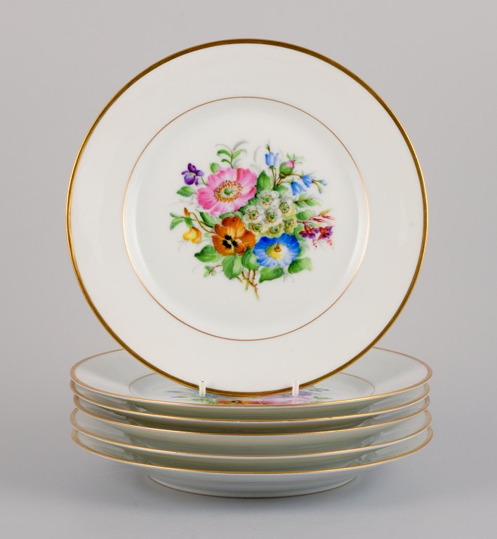 Bing & Grøndahl, six porcelain lunch plates hand-painted with polychrome flowers and gold decoration.