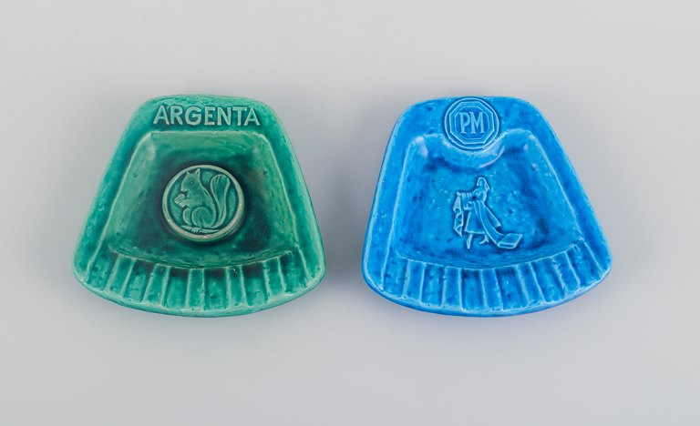 Rörstrand, two advertising ceramic ashtrays. Hand-decorated glaze in green and blue.
