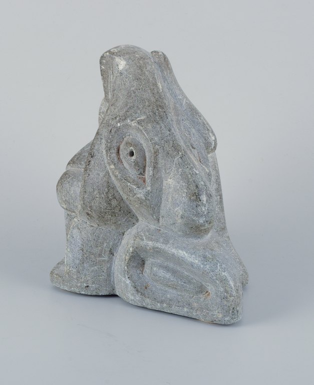 Greenlandica, Taki Petersen, heavy and massive sculpture in soapstone depicting hunter and a seal.