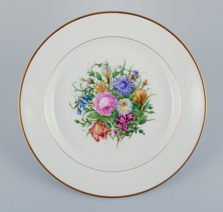 Bing & Grøndahl, large round serving platter in porcelain decorated with polychrome flowers and gold rim.
