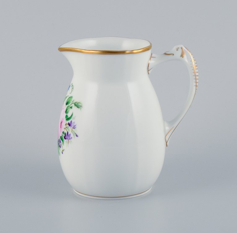 Bing & Grøndahl, porcelain jug decorated with polychrome flowers and a handle in the shape of a seahorse.