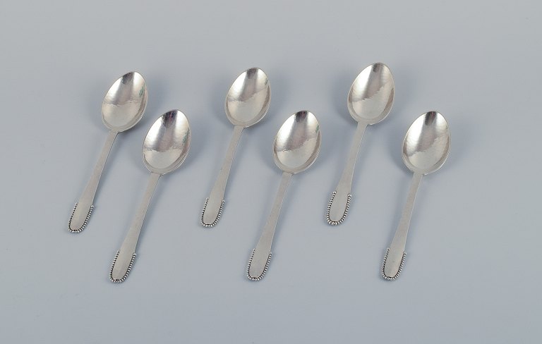 Georg Jensen Beaded.A set of six large dinner spoons in sterling silver.