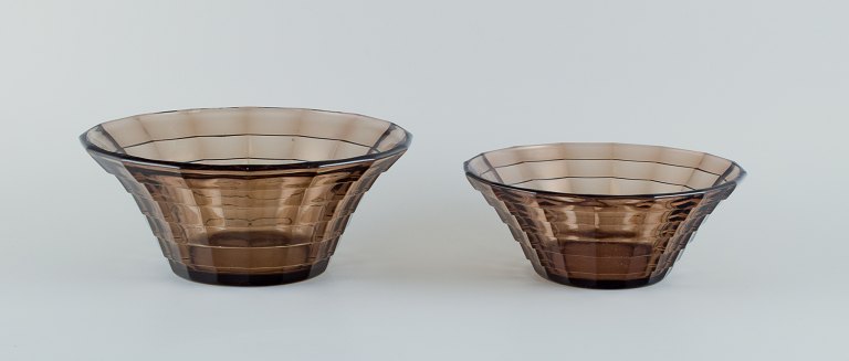 Simon Gate (1883-1945) for Orrefors/Sandvik, Sweden.Two large Art Deco bowls in smoked coloured pressed glass.