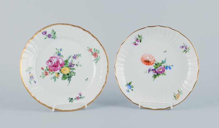 Royal Copenhagen, Saxon Flower, a plate and a low bowl hand-decorated with polychrome flowers and a gold rim.