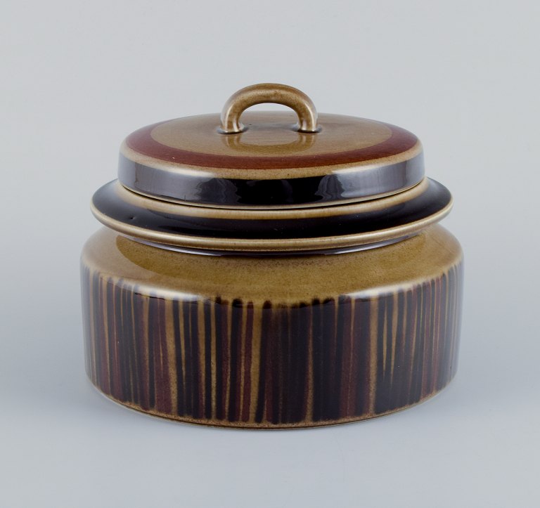 Gunvor Olin-Grönqvist for Arabia, a "Cosmos" covered tureen. Stoneware in a retro style with brown tones.