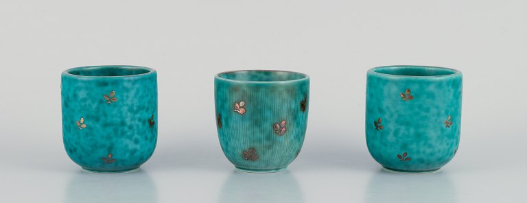 Wilhelm Kåge for Gustavsberg, three small "Argenta" ceramic vases. Glaze in green tones with silver inlays in the shape of leaves.