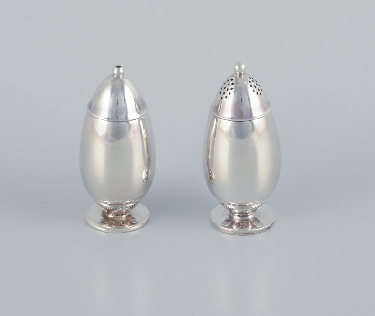 Gundorph Albertus (1887-1970) for Georg Jensen, Denmark, "Cactus" salt and pepper shakers in sterling silver.