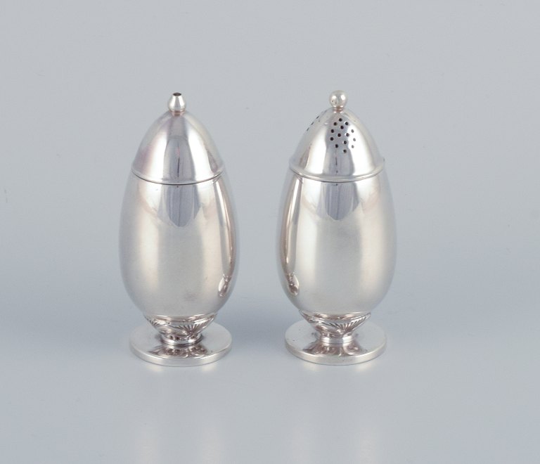 Gundorph Albertus (1887-1970) for Georg Jensen, Denmark, "Cactus" salt and pepper shakers in sterling silver.