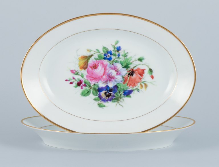 Bing & Grøndahl, two oval platters hand-painted with polychrome flower motifs and gold trim.