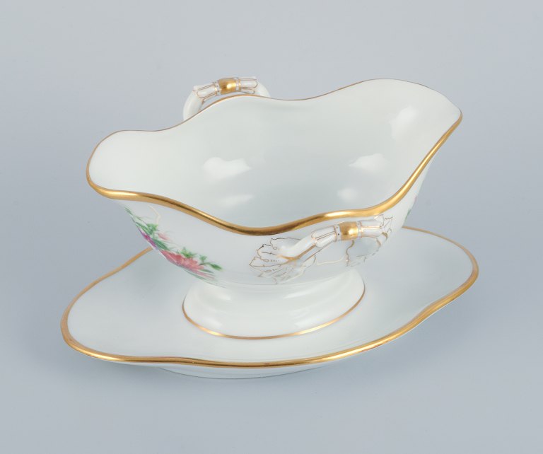 Bing & Grondahl, hand-painted sauce boat with polychrome flower motifs and gold trim.