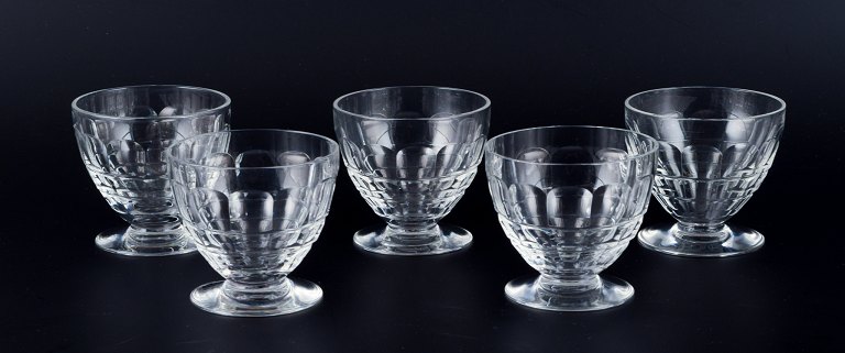 Baccarat, France, a set of five "Charmes" Art Deco white wine glasses in clear crystal glass. Faceted cut.