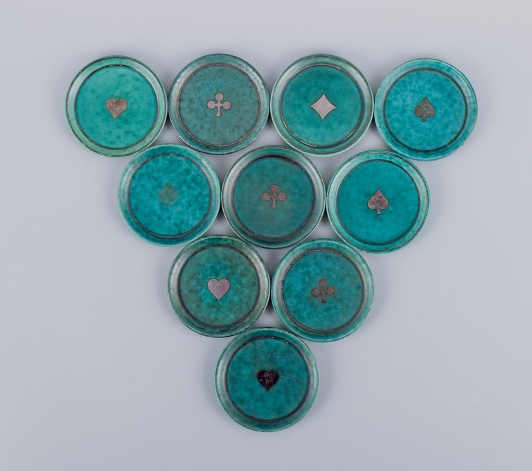 Wilhelm Kåge for Gustavsberg, Sverige. Et sæt på ti ”Argenta” coasters-/flaskebakker.