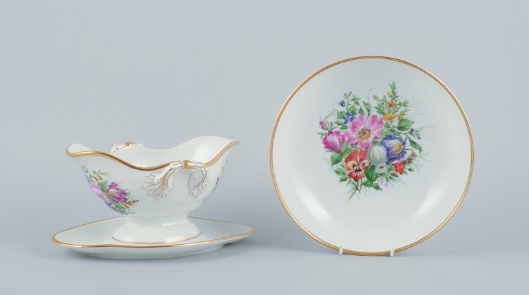 Bing & Grøndahl, a hand-painted sauceboat and bowl decorated with polychrome flowers.