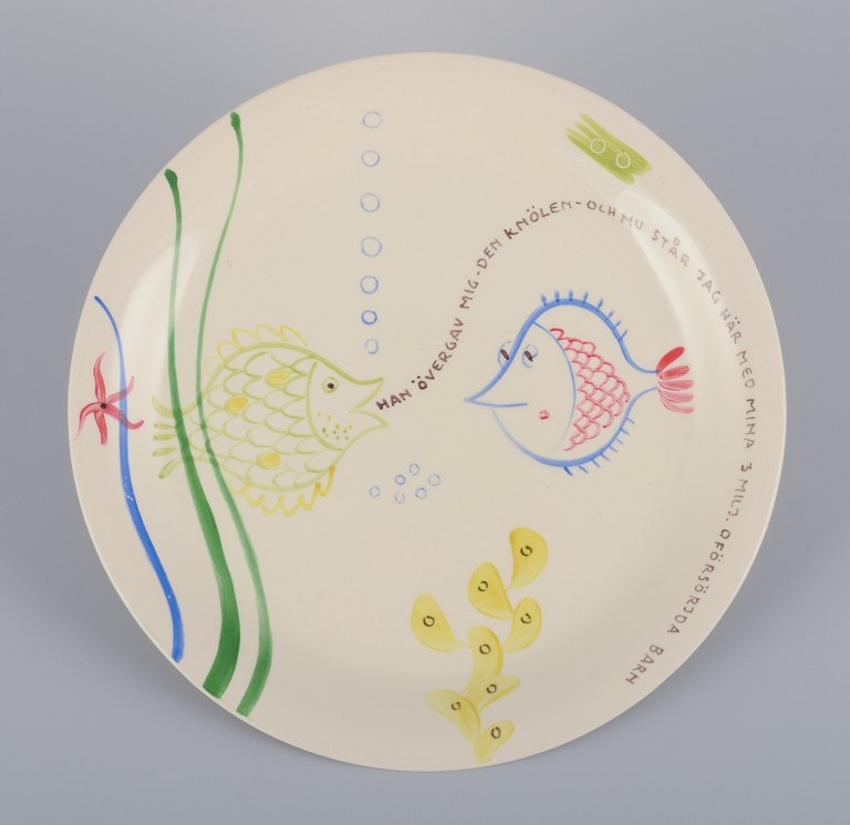 Stig Lindberg for Gustavsberg. "Löja" plate. Hand-painted with a fish motif. Satirical illustration with Swedish text.
