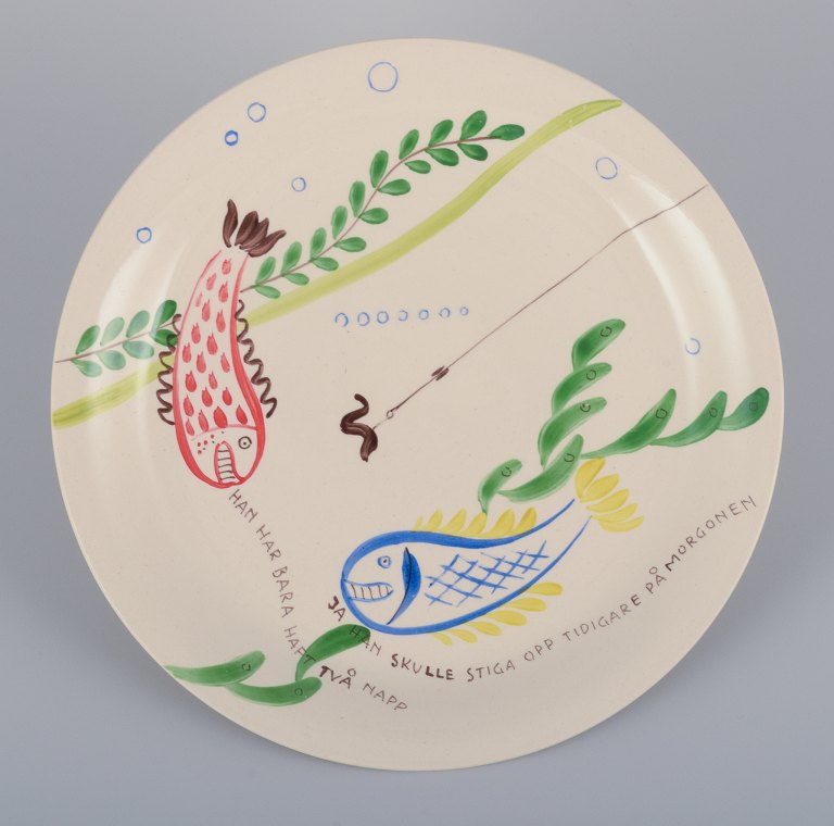 Stig Lindberg for Gustavsberg. "Löja" plate. Hand-painted with a fish motif. Satirical illustration with Swedish text.