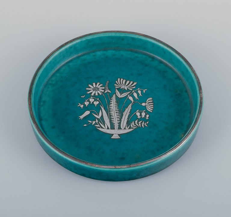 Wilhelm Kåge for Gustavsberg, Sweden, low Art Deco ceramic bowl with silver decoration featuring a floral motif. From the "Argenta" series.