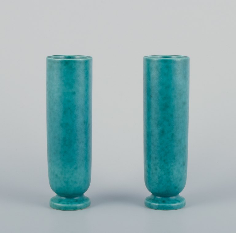 Wilhelm Kåge (1889-1960) for Gustavsberg, Sweden. A pair of tall and slender Art Deco ceramic vases with classic green glaze. From the Argenta series.