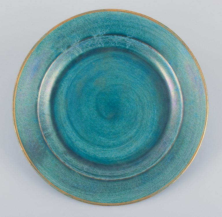 Josef Ekberg for Gustavsberg, Sweden. Large round ceramic dish with green-toned glaze and gold rim.