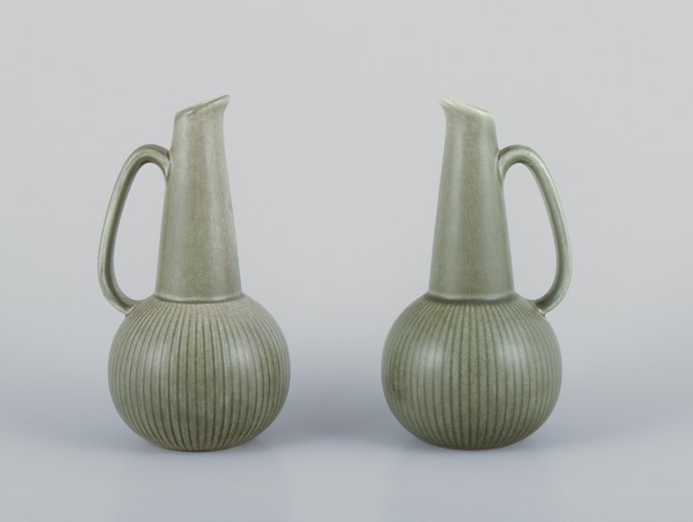 Gunnar Nylund for Rörstrand, Sweden. A pair of Ritzi ceramic pitchers with green glaze.
