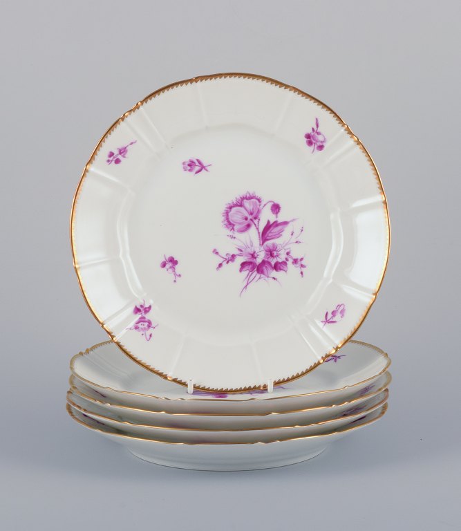 Bing & Grøndahl, Denmark. A set of five luncheon plates with flower decorations in purple and gold trim. Hand-painted.