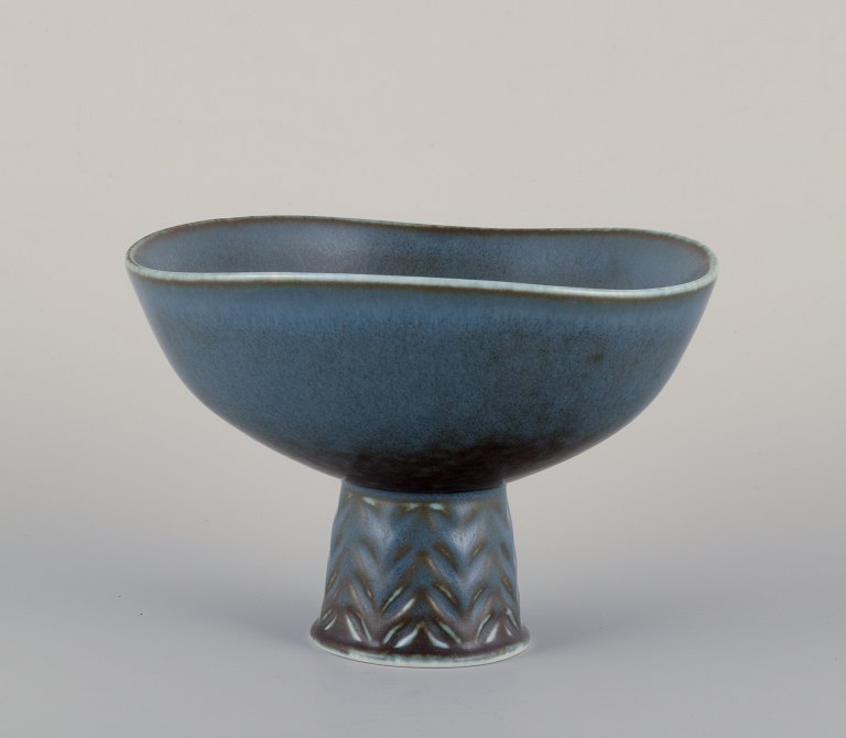 Carl Harry Stålhane for Rörstrand, Sweden. Ceramic bowl on a pedestal.Glaze in blue tones.
