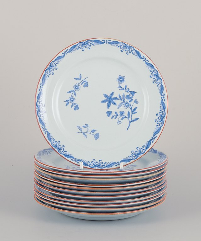 Nils Emil Lundström for Rörstrand, Sweden. A set of twelve "Ostindia" plates in faience with flower motifs.
