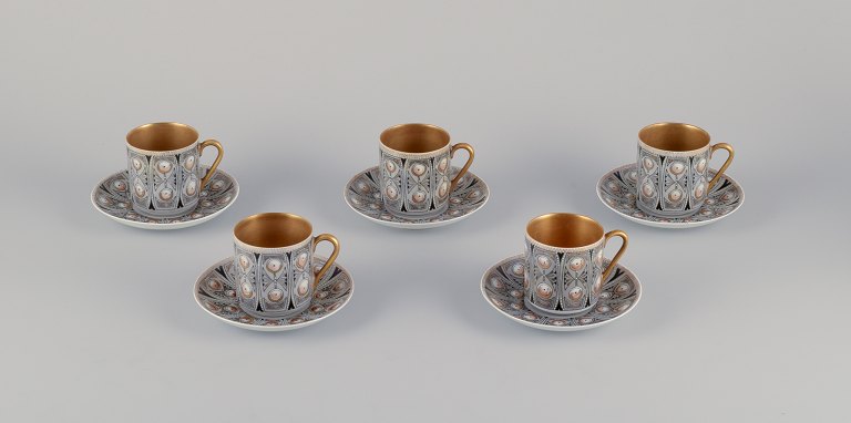 Raija Uosikkinen, Arabia, a set of five "Asta" coffee cups with saucers. Hand-decorated in a modernist style.