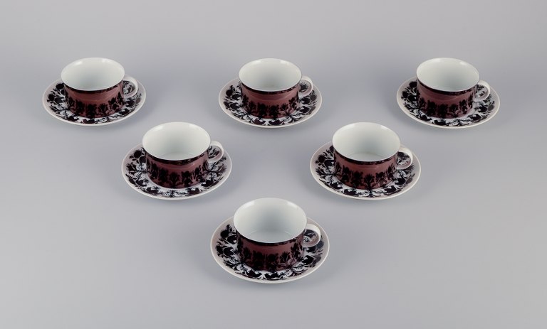 Bjørn Wiinblad for Rosenthal, et sæt på seks ”Berlin Hilton” kaffekopper med underkopper i porcelæn. Glansfuld kobberfarvet dekoration.