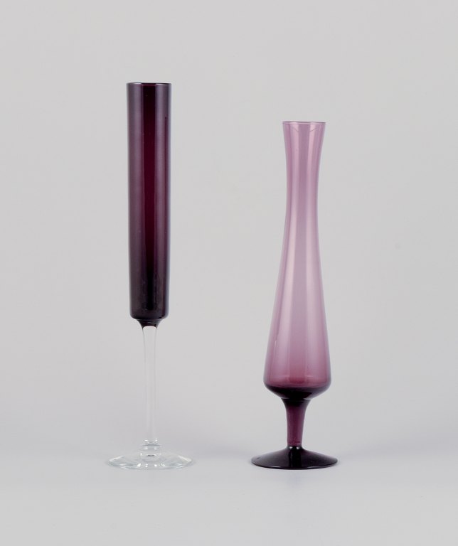 Swedish designer, two vases in art glass crafted in a slim design.Violet and clear mouth-blown glass.