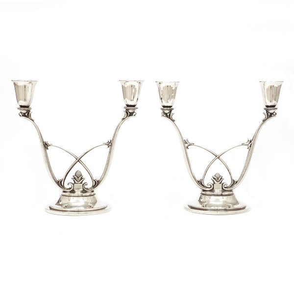 Pair of Georg Jensen sterlingsilver candelabra designed by Harald Nielsen. #619. H: 16,8cm. W: 833gr