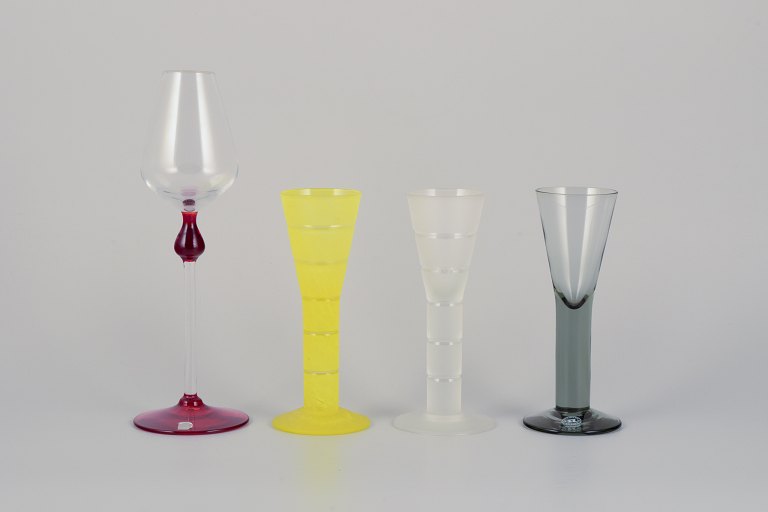 Margareta Hennix for Reijmyre, Sweden. A set of three schnapps glasses and a tall and slender liqueur glass. Handmade and mouth-blown art glass in different colors.