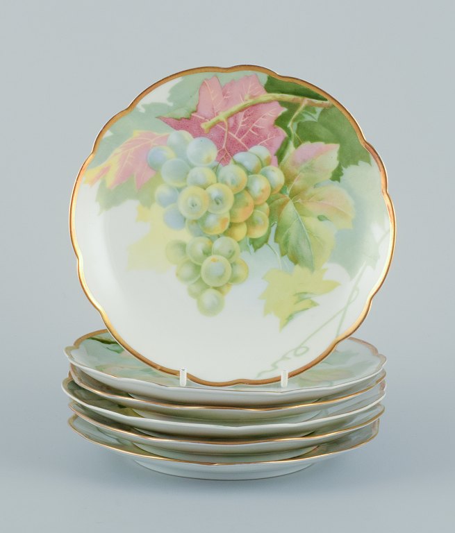 Rosenthal, Tyskland. Et sæt på seks porcelænstallerkner med forskellige frugtmotiver. Guldkant.