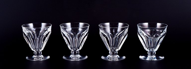 Baccarat, France. A set of four Art Deco white wine glasses in faceted crystal glass.