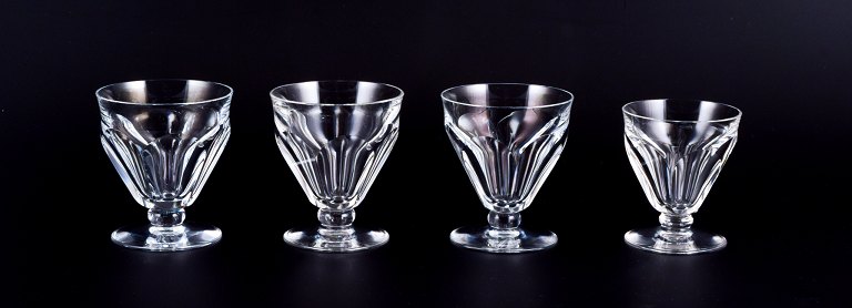 Baccarat, France. A set of four Art Deco glasses in faceted crystal glass.One glass is slightly smaller.